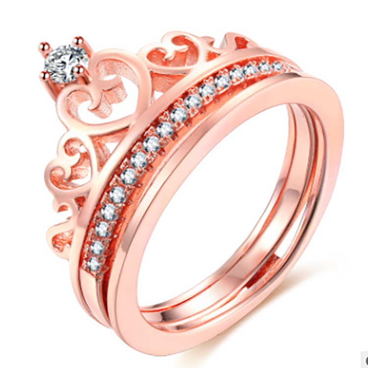 A rose gold crown with two rings