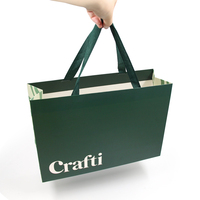 Sacs en papier vert de luxe pour emballages cadeaux, sacs en papier pour vêtements, sacs en papier personnalisés de bonne qualité