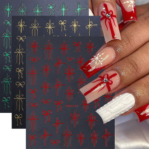 Autocollants pour ongles en forme de nœud cadeau de Noël, 3 couleurs, or métallique, vert, <span class=keywords><strong>rouge</strong></span>, design simple en ruban, bricolage, autocollants pour <span class=keywords><strong>manucure</strong></span>, décorations de vacances - Product Image 1
