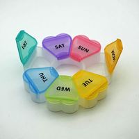 Nouvelle conception, boîte à pilules ronde personnalisée en plastique pour 7 jours, forme de fleur, boîte à pilules ronde de qualité alimentaire pour 7 jours, pour les voyages