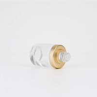 Flacon compte-gouttes en verre transparent de 30ml pour le visage et le corps avec couvercle en or blanc de luxe personnalisé pour cosmétiques