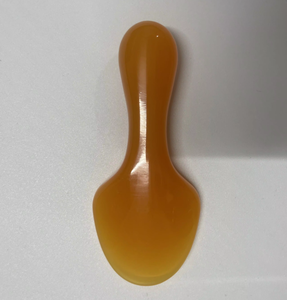 Planche de massage en résine de couleur ambre en forme de pelle - Product Image 1