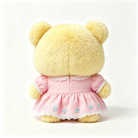 Ours en peluche compact Kawaii avec tenue à volants et imprimé floral, texture douce et bouclée, jouet en peluche animal en peluche