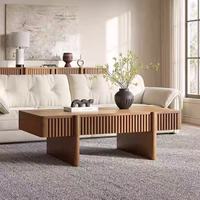 Table basse rectangulaire en chêne massif rainuré sur mesure avec tiroir dissimulé et texture côtelée pour hôtel et appartement