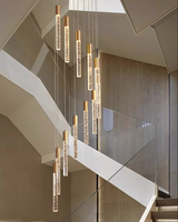 Long lustre de lampe d'escalier de luxe simple moderne avec phare rotatif en métal rond en verre pour Villa Loft Appartement Salon