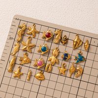 Charmes de la vie marine dorés |   Pendentifs en acier inoxydable plaqués or 18 carats PVD en gros |   Étanche, hypoallergénique et sans ternissement