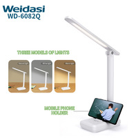 Lampe de Lecture LED Pliable avec 3 Niveaux de Luminosité et Support Téléphone Intégré
