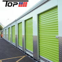 Porte de garage isolée à enroulement avec système de verrouillage anti-vent pour bâtiments de grande hauteur