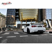 Kit carrosserie large Rocket Bunny pour BMW M3 E92 E93, comprenant pare-chocs avant, spoiler, ailes et aileron arrière en fibre de verre.