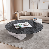 Table basse ronde en verre trempé à texture d'eau ondulée noire de luxe moderne avec pieds en colonne de marbre pour salon
