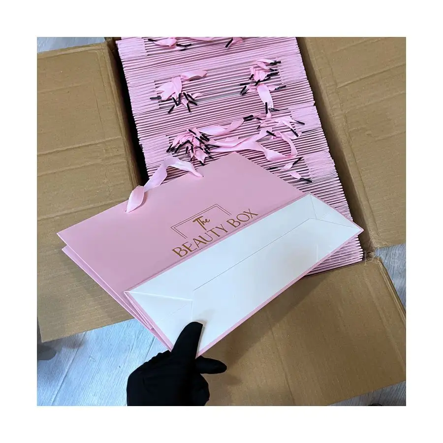 Sacs à cheveux roses pour fagots rose de qualité supérieure Sac à provisions en papier pliable blanc de luxe Logo personnalisé