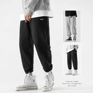 Qyou-Pantalones informales holgados De algodón para Hombre y mujer, pantalón De chándal con logotipo personalizado en color negro, Unisex, MJ15