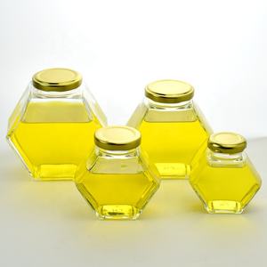 ขายส่งโลโก้ที่กําหนดเองที่ชัดเจนการจัดเก็บขวดน้ําผึ้ง dipper ภาชนะเปล่าขวดน้ําผึ้งแก้วหกเหลี่ยมขวดรูปน้ําผึ้งพร้อมฝาปิด - Product Image 1