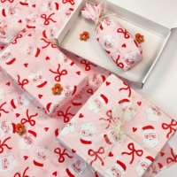 Papier de soie Père Noël sur fond rose, feuilles de papier cadeau personnalisées pour le rembourrage des sacs cadeaux, décoration de fête de fin d'année