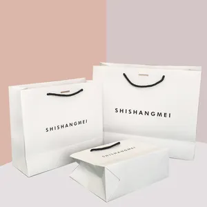 Белые роскошные водонепроницаемые бумажные пакеты и коробка для одежды, ювелирных изделий, упаковка для покупок с черными ручками