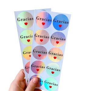 Etichette Adesive Impermeabili Ecologiche e Durevoli in Rotolo per Cancelleria, Scrapbook, con Scritte in Francese e Spagnolo: Grazie, Merci - Product Image 1