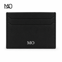 Porte-cartes en cuir noir minimaliste avec texture Saffiano, design géométrique à fentes et emplacements horizontaux pour cartes OEM