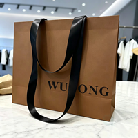 Sac cadeau en papier kraft de luxe écologique avec logo personnalisé et poignées en ruban pour l'emballage de bijoux et la vente au détail
