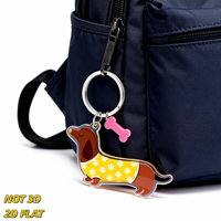 Porte-clés Teckel avec breloque os rose, porte-clés chien en acrylique, motif patte jaune, accessoire fantaisie léger
