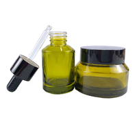 Olive Green 5ml 30ml 60ml 125ml 200ml botol Lotion kaca kosmetik mewah botol pompa belakang sekrup bambu kulit desain bahu miring