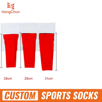 Chaussette de football de conception moderne de prix usine avec la poignée personnalisée chaussettes antidérapantes de serviette de football en gros chaussette de sport de terrasse