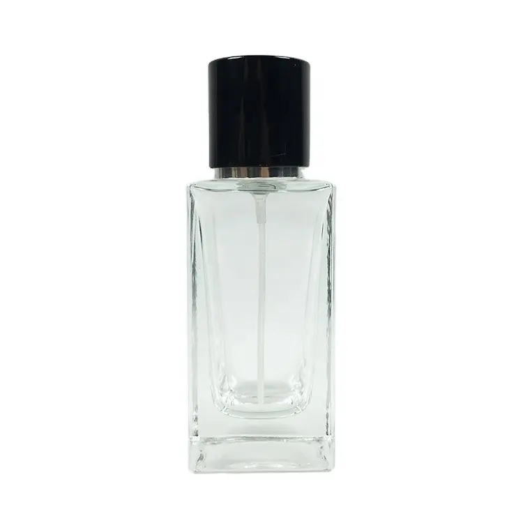 光沢のある黒い磁気キャップ付きの高正方形の透明な50ml香水ガラスボトル空の厚い底の香水スプレーボトル