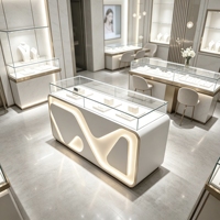 Comptoir de présentation de bijoux moderne blanc verrouillable avec éclairage LED pour attirer les clients dans les boutiques de détail
