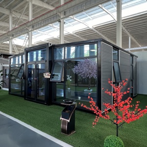 Maison en conteneur préfabriquée élégante sur mesure avec construction robuste, remorque de petites maisons à construction rapide de Chine sur roues - Product Image 1