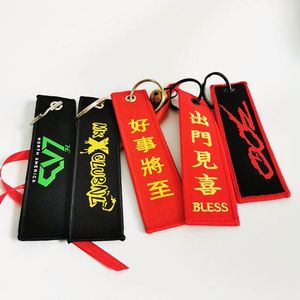 Wholesale Customized Remove Luggage Tag Label Before Embroidery Keyring Flight for logo Woven Keychains - Product Image 1