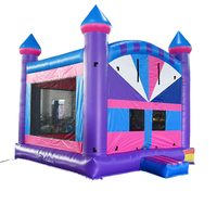 Château gonflable coloré avec toboggan, thème soleil et palmiers, qualité commerciale pour les fêtes d'enfants, les locations, les écoles et les événements