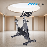 Vélo de Gymnastique Élégant et Haut de Gamme MND Fitness – Équipement Cardio pour Studio et Chaîne de Salles de Sport à Paris – Fonctionnement Silencieux