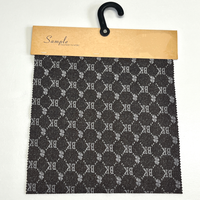 Tissu en denim jacquard noir et gris avec logo rétro en lettres pour vêtements, vestes et sacs