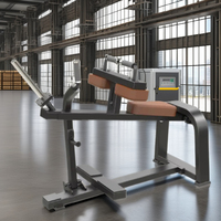 Appareil de musculation assis pour les mollets, à charge libre, pour l'entraînement des soleus, des gastrocnémies et des mollets.