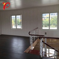 Entrepôt 2 étages garage cottage kits fournisseur moins cher 40ft 2 chambre à coucher en forme de capsule conteneur pas cher maisons préfabriquées