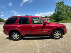 Véhicule d'occasion pas cher Rainier AWD CXL Plus SUV 4 portes 2004 avec régulateur de température, radio, On-Star, sièges en cuir gauche, phares à LED - Product Image 6