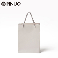 Sacs shopping en papier blanc personnalisés avec logo PINUO, poignée en cordon torsadé, sac cadeau en papier kraft de luxe pour l'emballage de bijoux en détail
