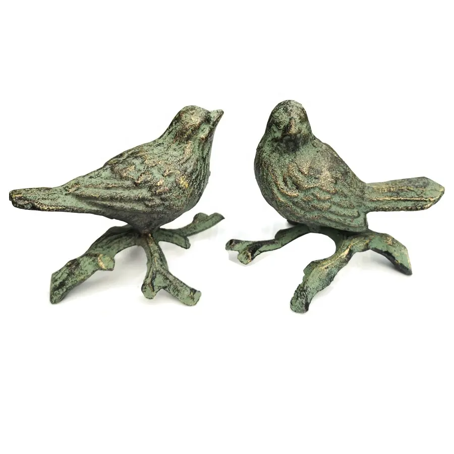 Pares de pájaros de hierro fundido en figuritas de ramas