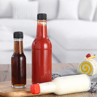 150ml vente en gros bouteille en verre de forme ronde de haute qualité personnalisée avec bouchon à vis pour la nourriture pour assaisonner les sauces à confiture de miel d'épices