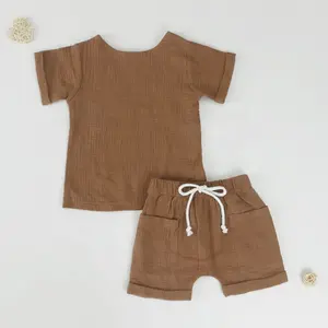 للبيع بالجملة أطقم ملابس صيفية للأطفال من قماش طبقات مزدوجة من القطن بنسبة 100% عالية الجودة