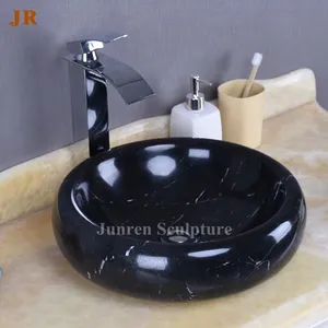 Lavabo de table en marbre noir de luxe d'hôtel