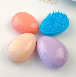 <span class=keywords><strong>Cepillo</strong></span> de pelo desenredante en forma de huevo portátil para mujeres y niños peine de masaje de cuero cabelludo antinudo - Product Image 1