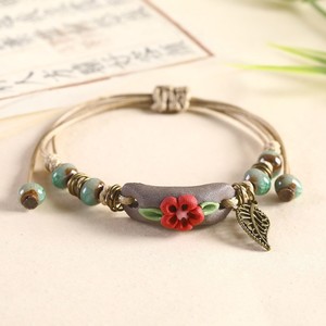 Bracelets rustiques faits main en corde cirée, style bohème, avec breloques florales en céramique (fleurs et feuilles) - Product Image 6