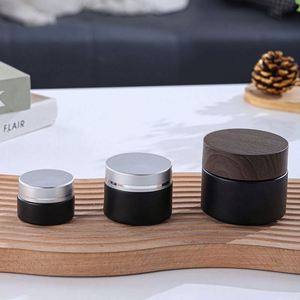Tarros cilíndricos de vidrio borosilicato ámbar negro mate esmerilado con tapa de rosca de bambú, 10g 50g, para crema facial, alta calidad, personalizados - Product Image 1