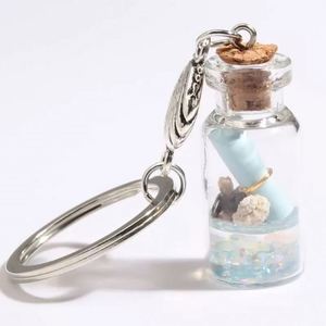 พวงกุญแจอะคริลิคใสลายปลาดาวในขวดลอยน้ำ - Product Image 1