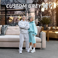 Ensemble de survêtement unisexe Kuest personnalisé gris avec sweat à capuche zippé oversize et pantalon de jogging long, idéal pour l'hiver et les loisirs