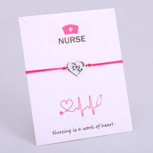 กำไลมือแพทย์พยาบาลโยคะรูปหัวใจโอมโอห์มทำจากสเตนเลสสตีล18K สีทอง Hamsa - Product Image 2