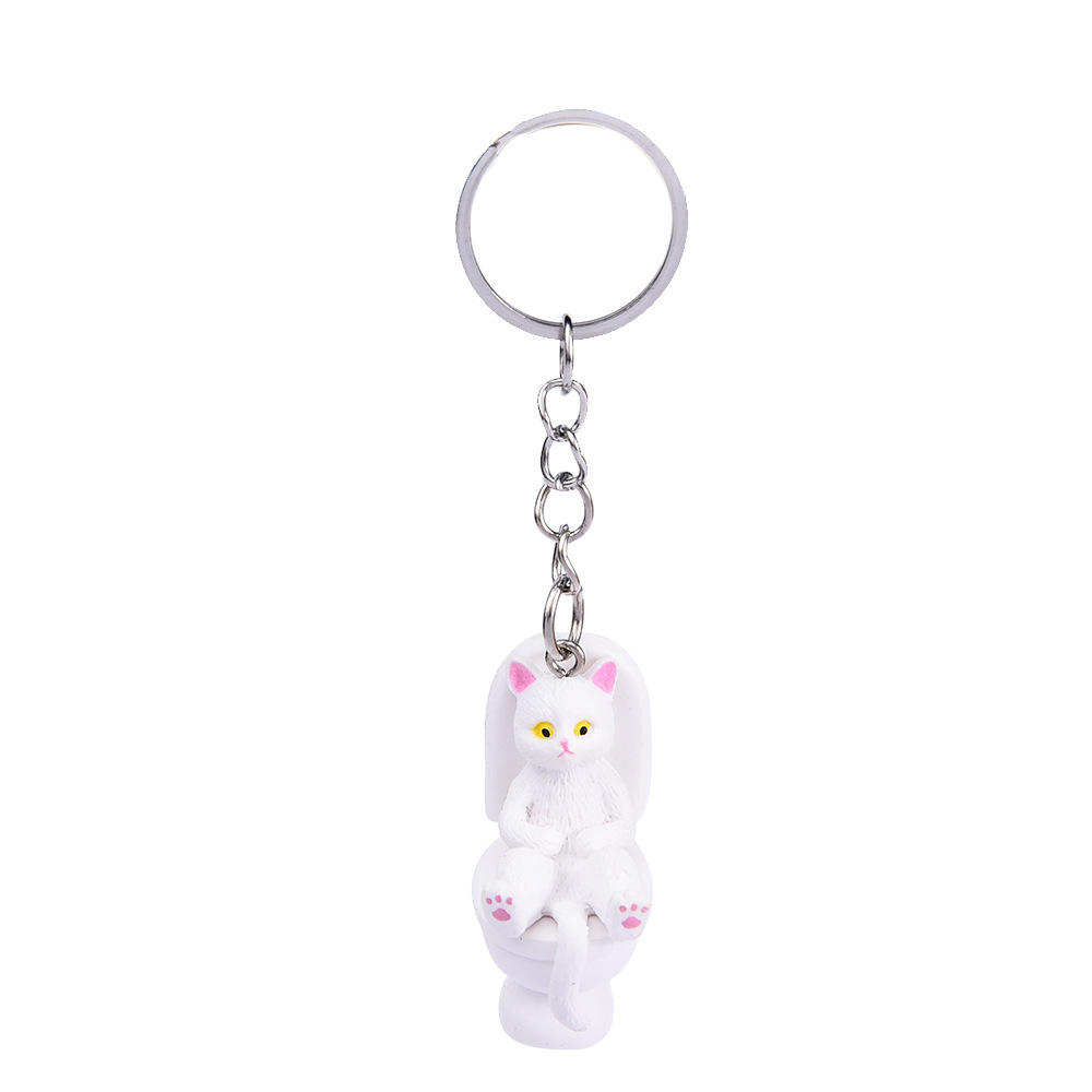 Porte-clés chat de toilette blanc assis et couché