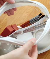 Vente en gros pochette de marque personnalisée en TPU étanche avec fermeture éclair maquillage sac de cosmétiques coquille givrée trousse de maquillage avec logo