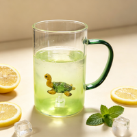 Tasses en verre résistant à la chaleur, tasse en verre transparent soufflé à la main avec une petite tortue 3D à l'intérieur, verre à boire avec poignée verte pour le café et l'eau