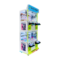 Table de jeu grue à pinces multi-stations de luxe pour 4 joueurs avec lumières LED colorées pour centres commerciaux à fort trafic